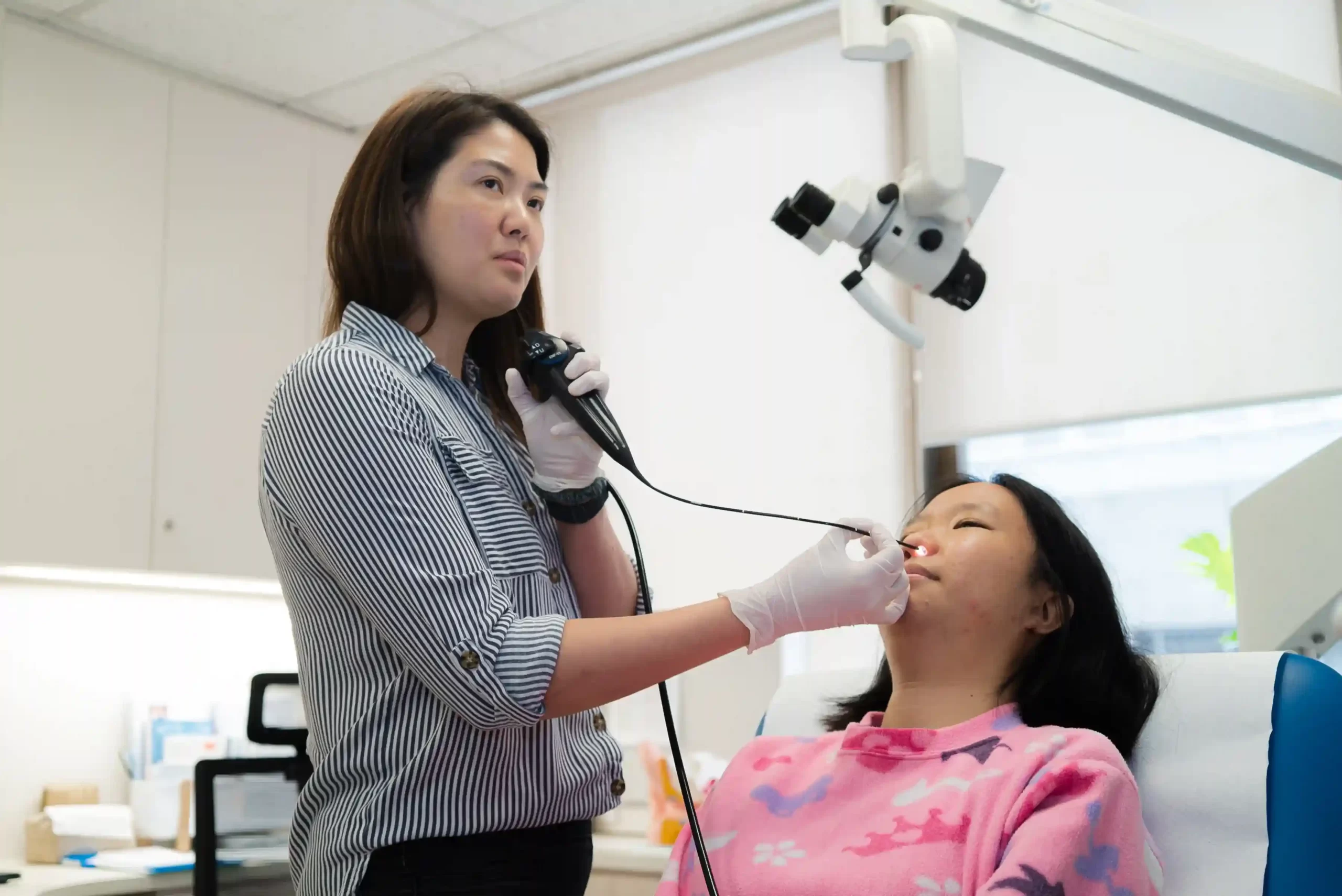 dr ker liang performing a naso-endoscopy on a patient